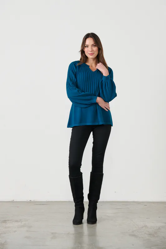 Model wearing Blue Top - Half Rib Knit & Puff Sleeve By Caju Available at Beetees Nelson