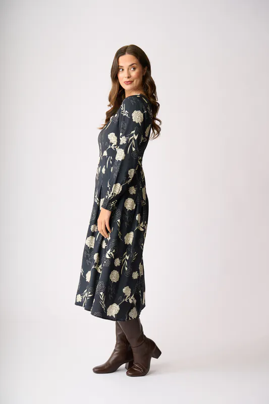 Model wearing Midnight Blooms Pleats Please Dress By Preen Available at Beetees Nelson