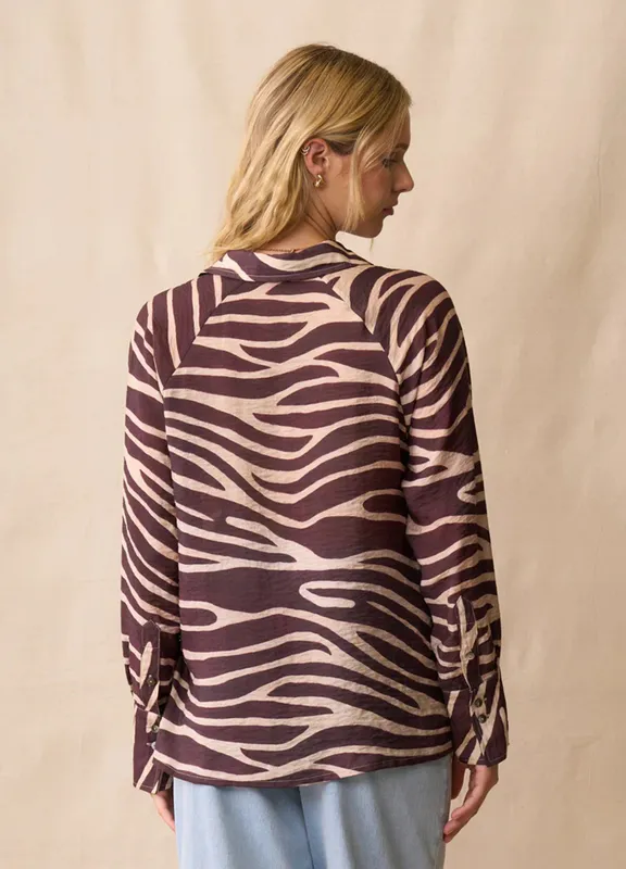 Model wearing Mahogany Dazzle Shirt By Neris Available at Beetees Nelson