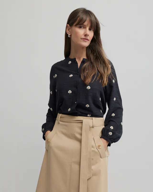 Model wearing Navy Queens Shirt By Yarra Trail Available at Beetees Nelson