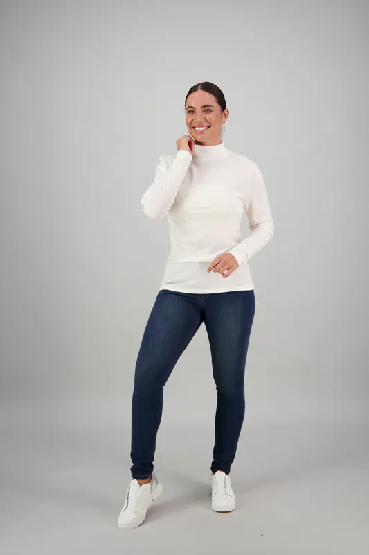 Model wearing Winter White Colour 100% Merino Basic Polo Neck Long Sleeve Top By Vassalli Available at Beetees Nelson