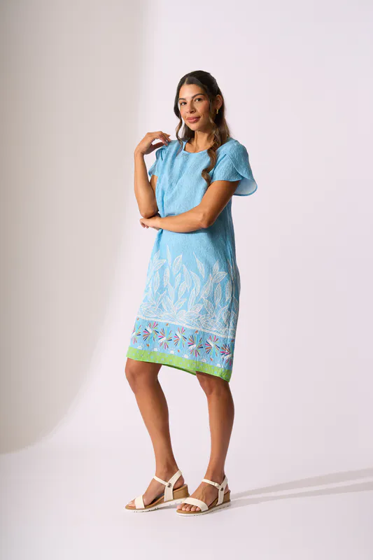 Model wearing Birds of Paradise Tulip Sleeve Dress By Foil Available at Beetees Nelson