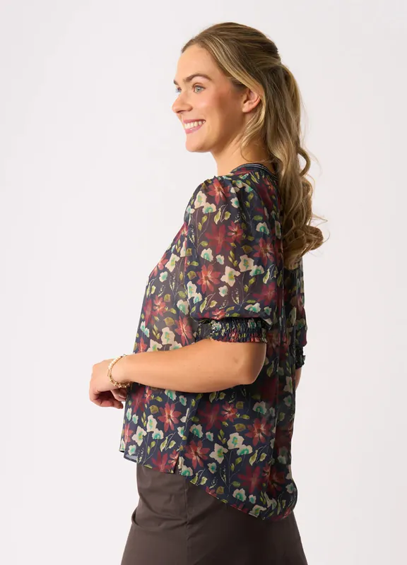 Model wearing Bloomtastic Rib Trim Blouse By Memo Available at Beetees Nelson