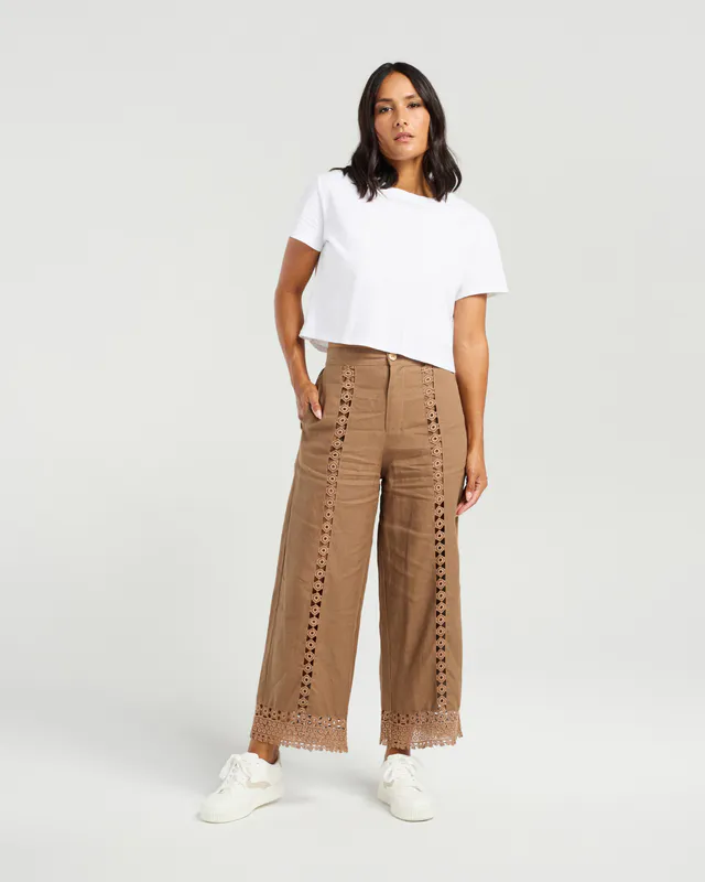 Model wearing Brown Flynn Pant By NMBR Rose Available at Beetees Nelson