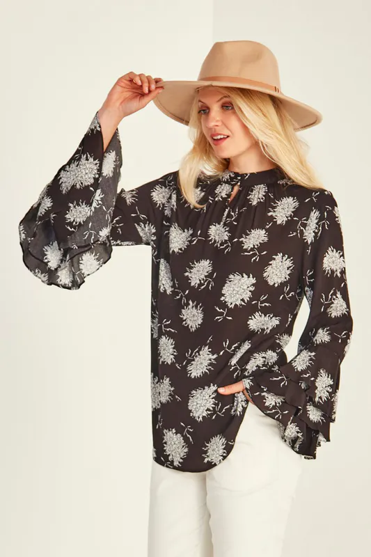 Model wearing Black Print Sam Blouse By Lemon Tree Design Available at Beetees Nelson