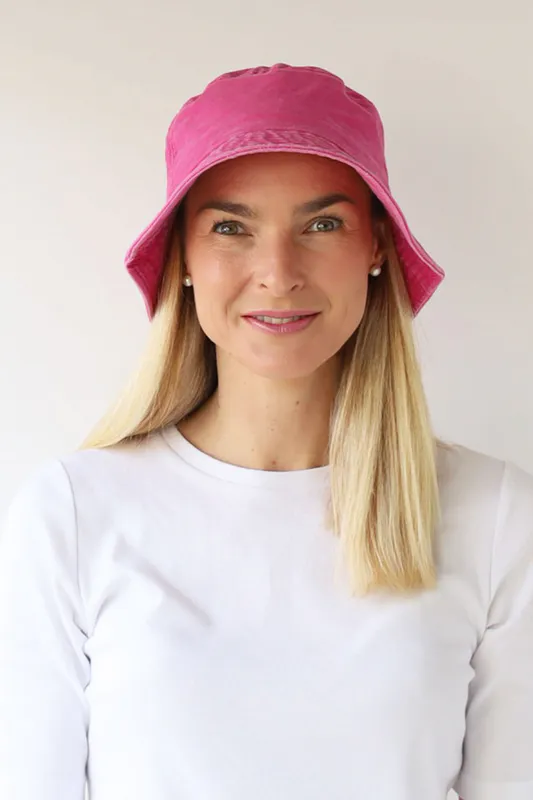 Model wearing Hot Pink Washed Bucket Hat By Archer House Available at Beetees Nelson