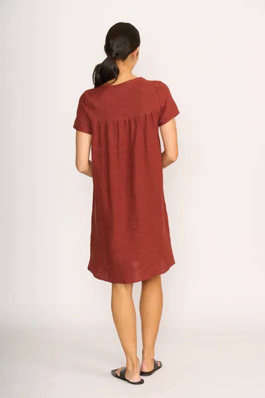 Model wearing Spice Dress - Panel Lines By Foil Available at Beetees Nelson