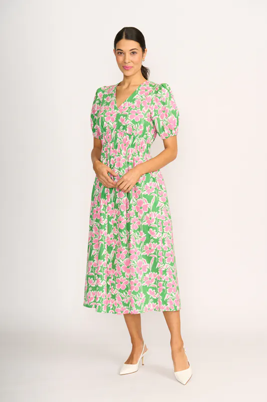 Model wearing Blossom Pop Dress - Shirred Empire Line By Foil Available at Beetees Nelson