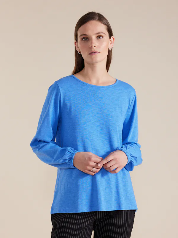 Model wearing blue coloured Gathered Sleeve Tee By Marco Polo available at Beetees Nelson