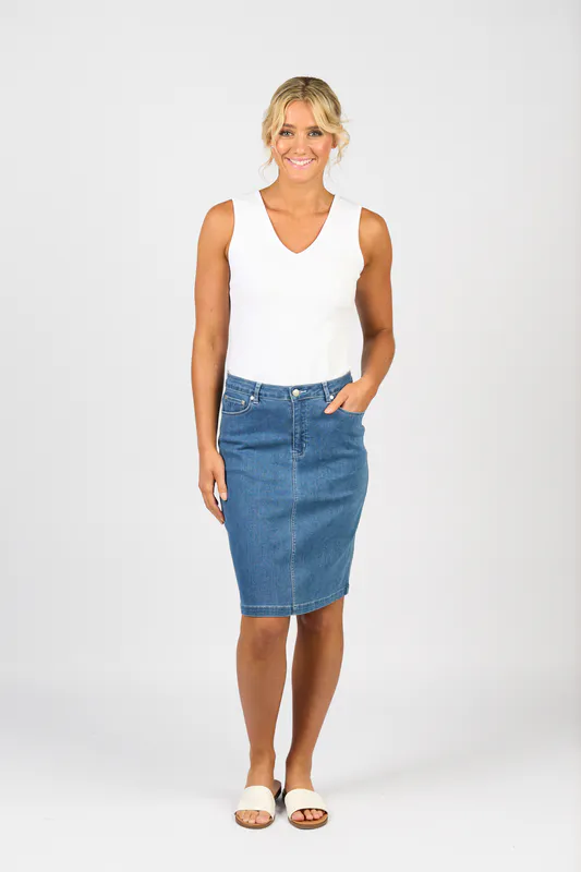 Model wearing Blue Hue Plain Denim Skirt with Back Vent By Vassalli Available at Beetees Nelson