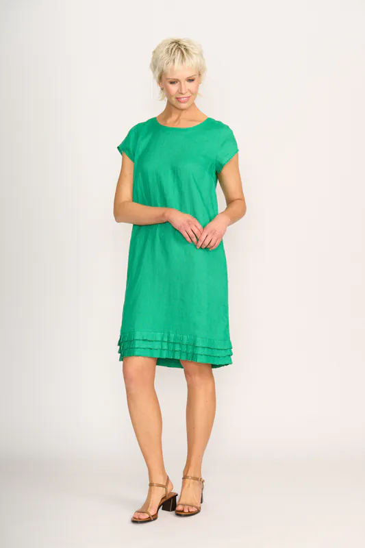 Model wearing green Dress - Pleat Dreams By Foil Available at Beetees Nelson