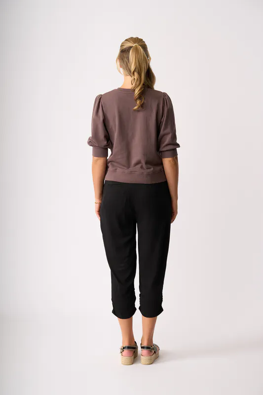 Model wearing Black Draped Cuff Trousers By Memo Available at Beetees Nelson