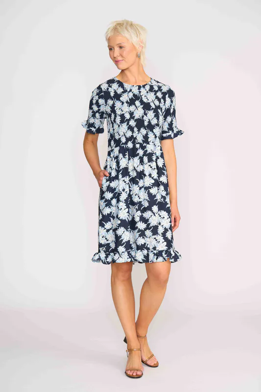 Model wearing Navy Sketch Floral Shirred Body And Sleeve Dress By Foil Available at Beetees Nelson