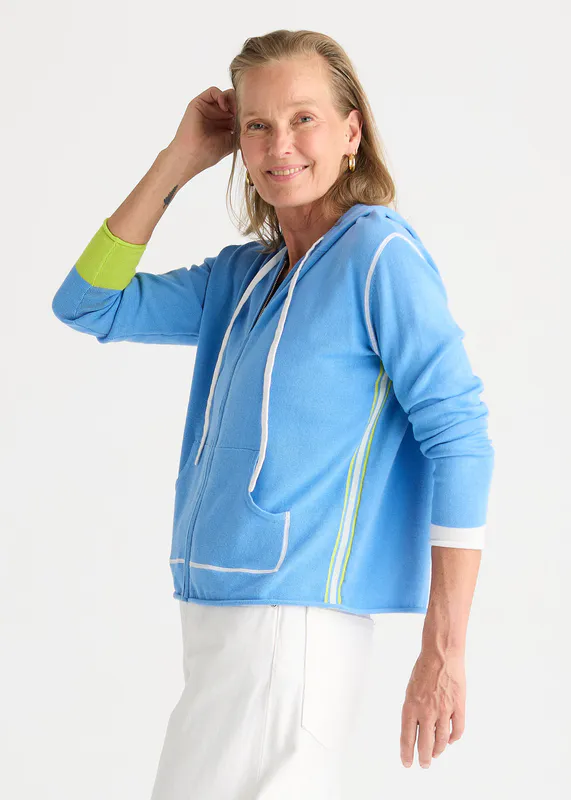 Model wearing Cornflower Sports Hoodie By Zaket & Plover Available at Beetees Nelson