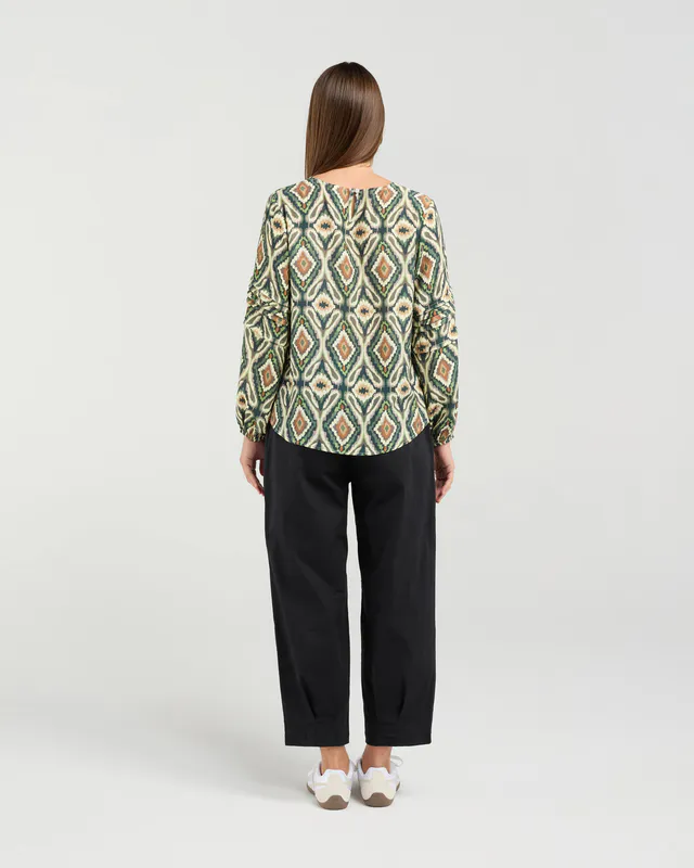 Model wearing Eden Green Aztec Skylar Pintuck Sleeve Top By Blackstone Available at Beetees Nelson