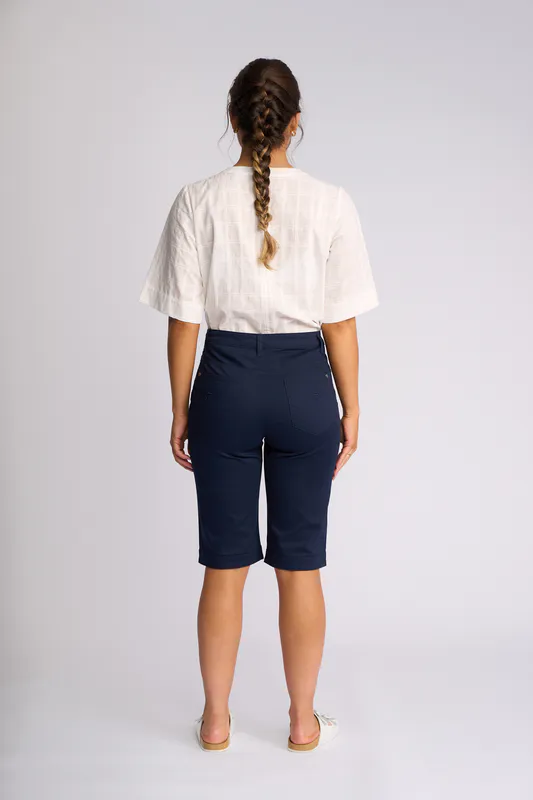 Model wearing Navy Custom Poplin Short By Vassalli Available at Beetees Nelson