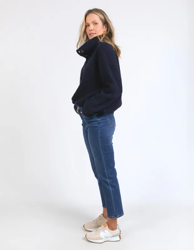 Model wearing Navy Bron Button Knit By Elm Available at Beetees Nelson