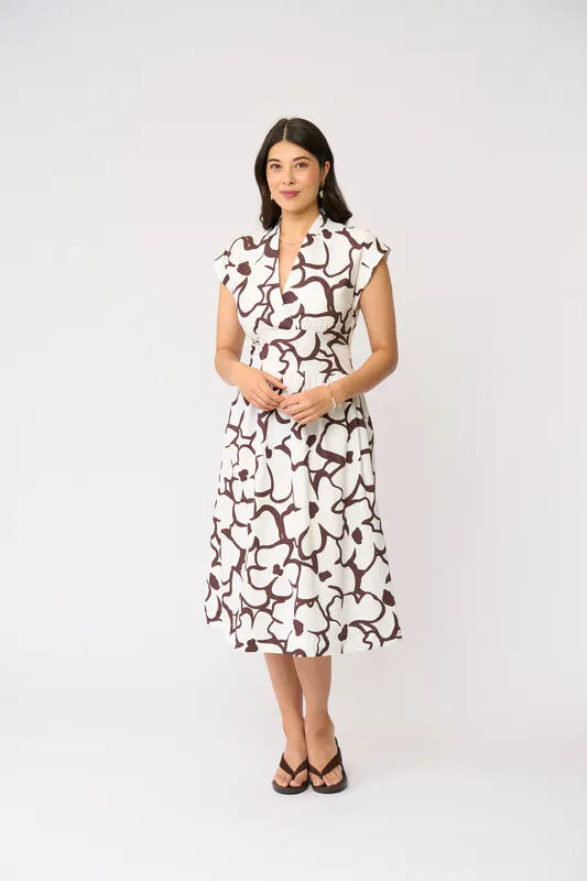 Model wearing Upsa-Daisy Gifted Dress By Foil Available at Beetees Nelson