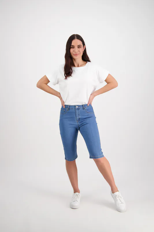 Model wearing Light Denim Slim Leg Contrast Stitch Denim Short By Vassalli Available at Beetees Nelson
