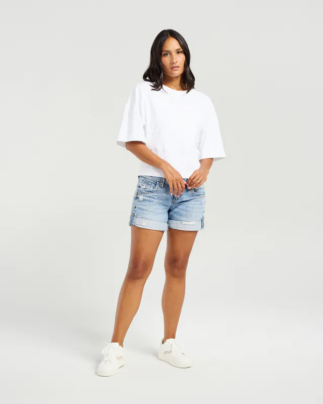 Model wearing White Kendell T-shirt By NMBR Rose Available at Beetees Nelson