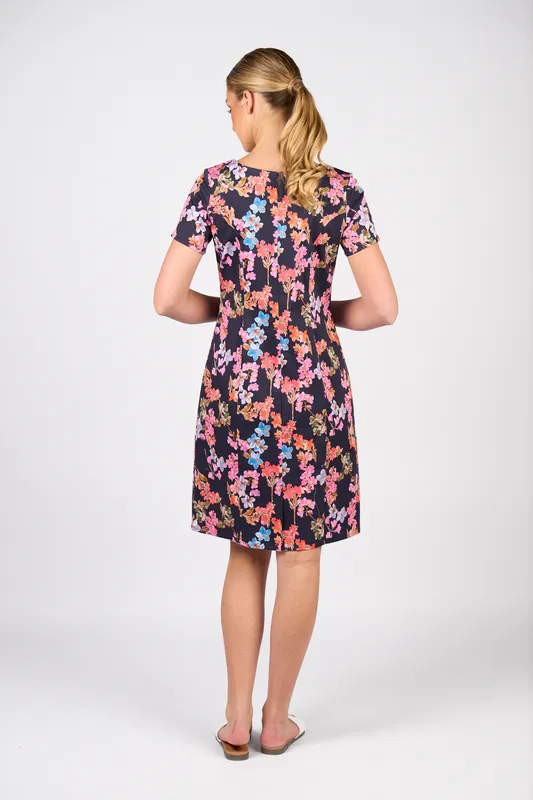 Model wearing Willa Printed Lightweight Fitted Dress with Short Sleeve By Vassalli Available at Beetees Nelson