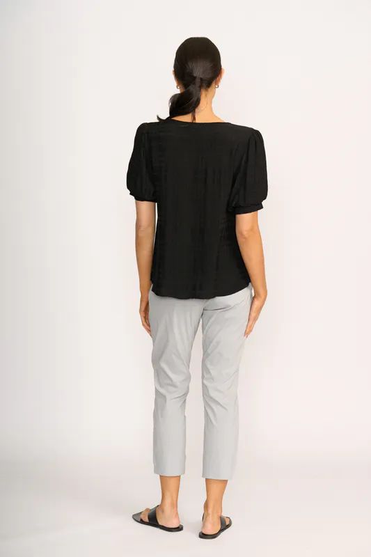 Model wearing Black Top - Volume Sleeve, Scoop Hem By OH Three Available at Beetees Nelson