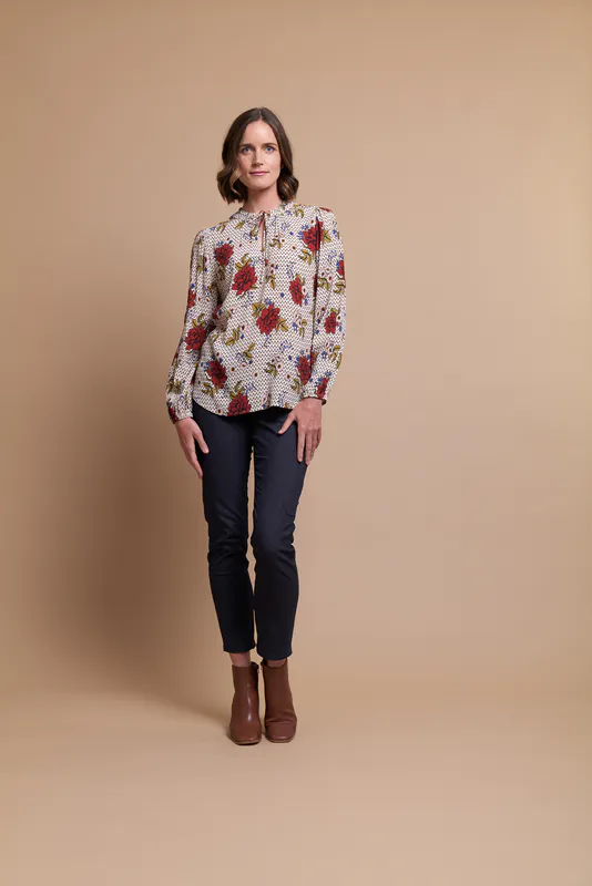 Model wearing Vintage Mosaic Coloured Blouse - Ruffle Neck, Elastic Cuff By Preen Available at Beetees Nelson