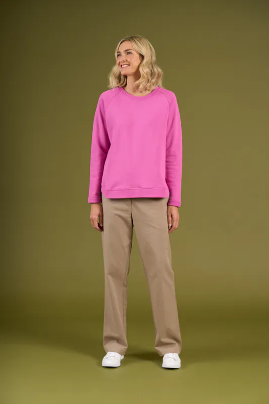 Model wearing Super Pink Brunswick Crew By Charlie Jane Available at Beetees Nelson