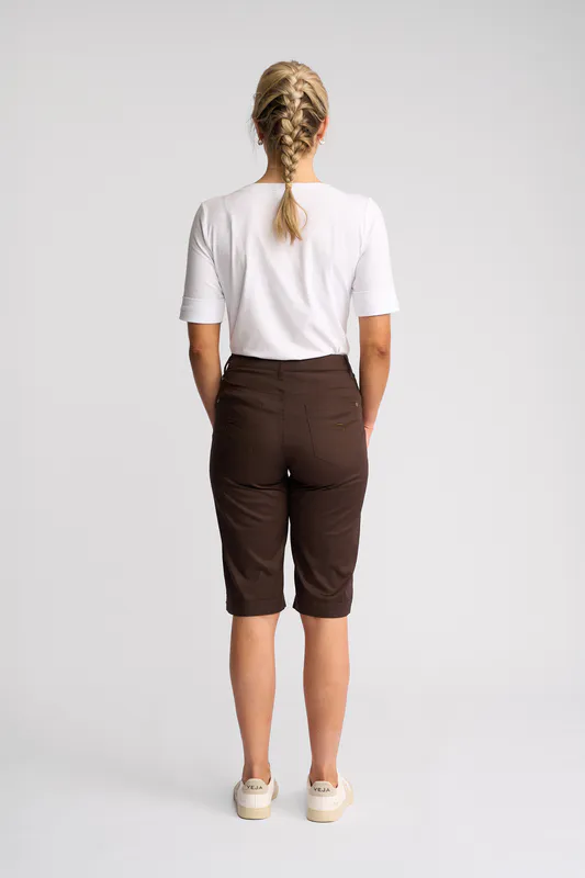 Model wearing Chocolate Custom Poplin Short By Vassalli Available at Beetees Nelson