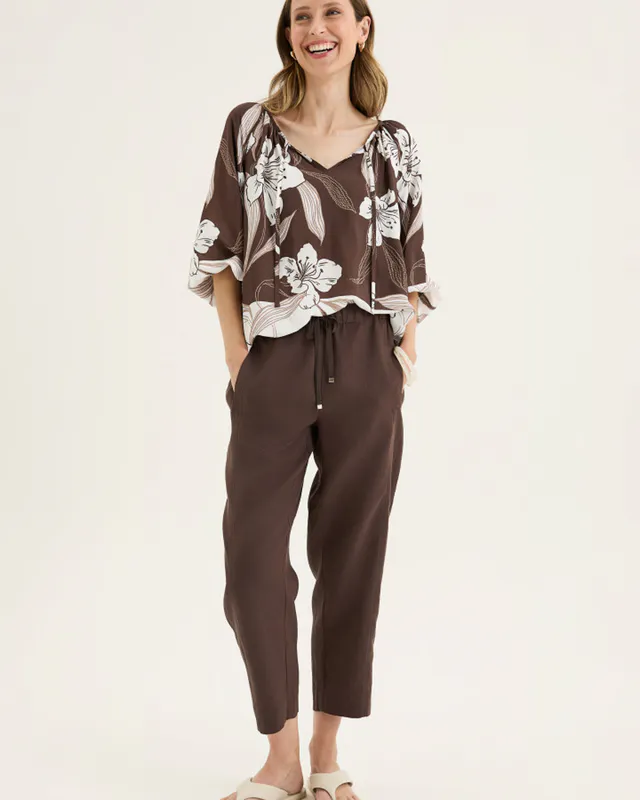 Model wearing Espresso Tirari Slim Pant By Yarra Trail Available at Beetees Nelson