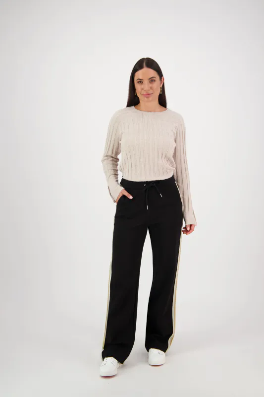 Model wearing Black Coloured Wide Leg Full Length Pant with Side Stripe Panel By Vassalli Available at Beetees Nelson