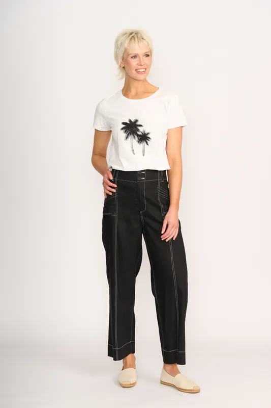 Model wearing Shady Palms Tee - Round Neck By Preen Available at Beetees Nelson