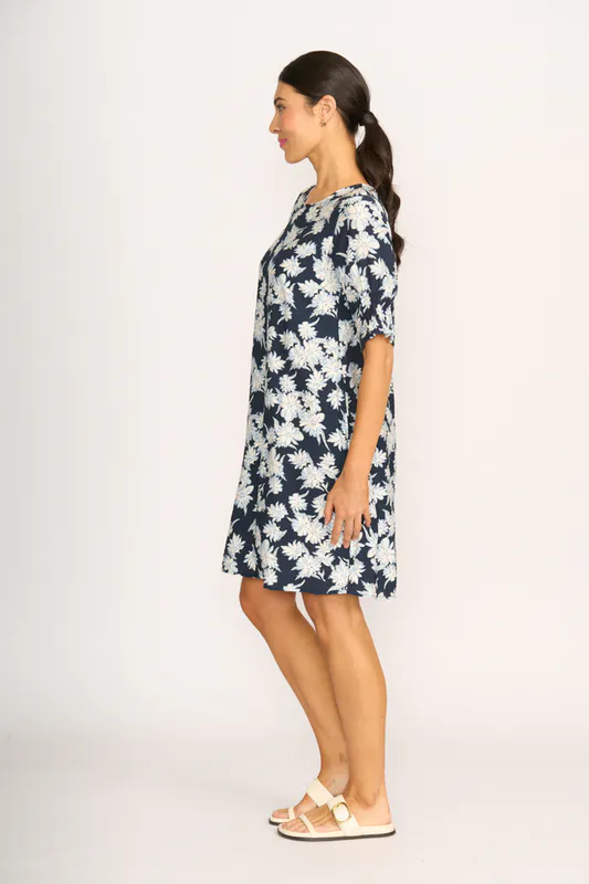 Model wearing Navy Sketch Floral Dress - Shirr The Cuff By Foil Available at Beetees Nelson