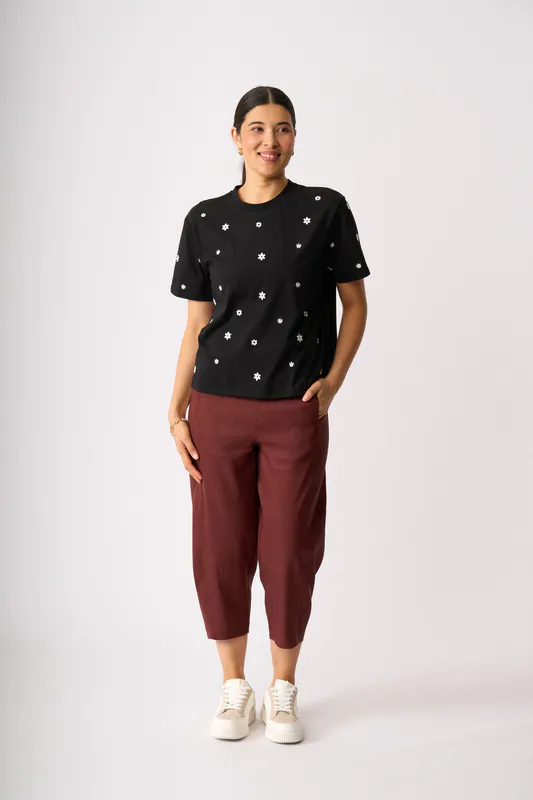 Model wearing Black Floral Embroidered Fun Tshirt By Memo Available at Beetees Nelson