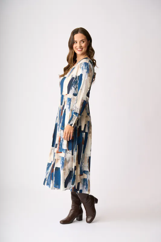 Model wearing Modern Art Pleats Please Dress By Preen Available at Beetees Nelson