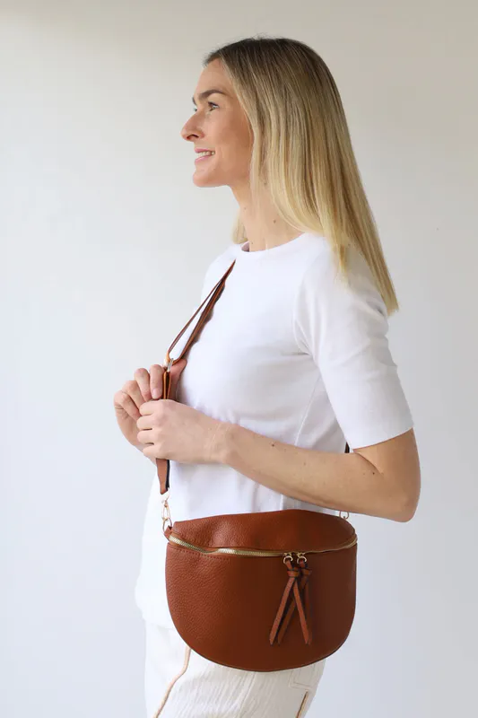 Model wearing Tan Cross Body Zip Detail Bag By Archer House Available at Beetees Nelson