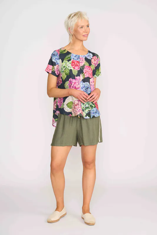 Model wearing Hydrangea Top - Swing, Up Down Hem By Preen Available at Beetees Nelson