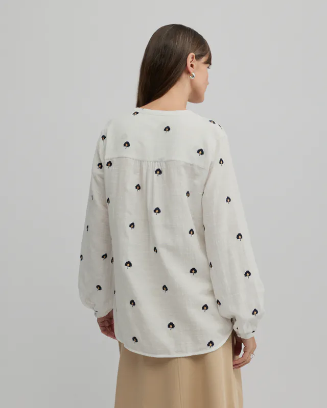 Model wearing Ecru Queens Shirt By Yarra Trail Available at Beetees Nelson