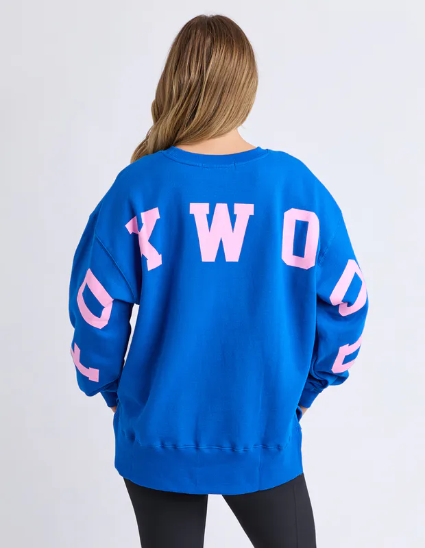 Model wearing Navy/Peach Interval Crew By Foxwood Available at Beetees Nelson