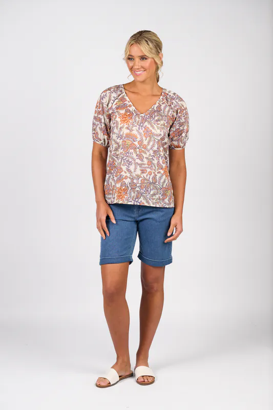 Model wearing Tuscany Printed V Neck Top with Floaty Sleeve By Vassalli Available at Beetees Nelson