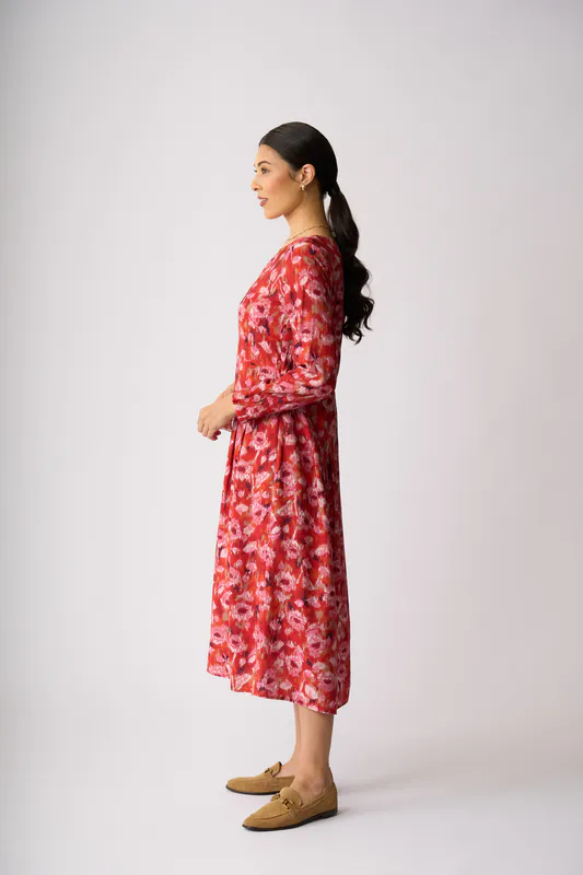 Model wearing Winter Blooms Pleats Please Dress By Preen Available at Beetees Nelson