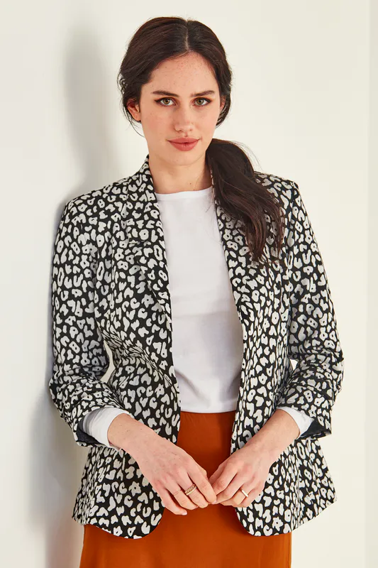 Model wearing Black and White Coloured Sophia Jacket By Lemon Tree Design Available at Beetees Nelson