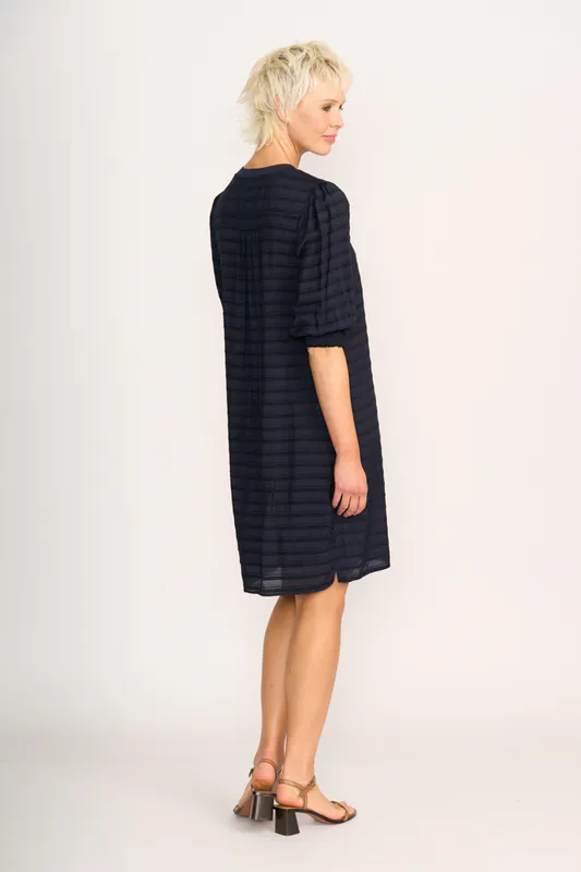 Model wearing Navy Stripe For Shirr Dress By Preen Available at Beetees Nelson