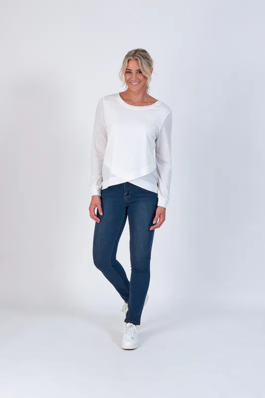 Model wearing Winter White Coloured 100% Merino Round Neck Top with Crossover Front By Vassalli Available at Beetees Nelson