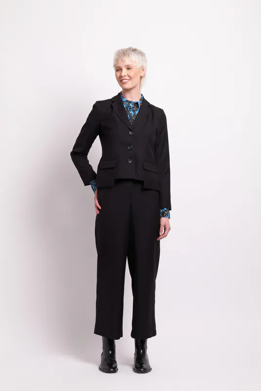 Model wearing Black Match Maker Blazer By Foil Available at Beetees Nelson