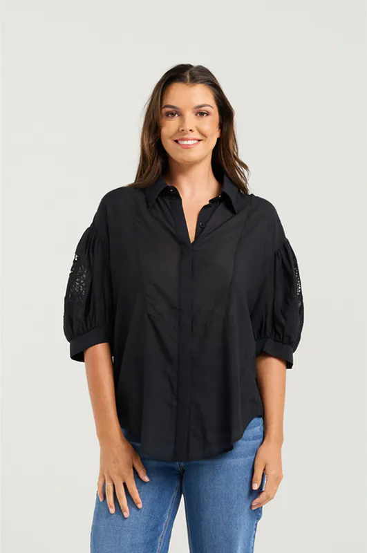 Model wearing Black Ella Shirt By NMBR Rose Available at Beetees Nelson