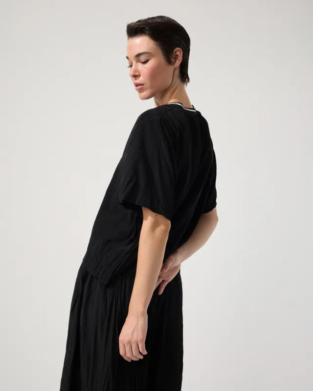 Model wearing Black Crushed Travel Top By Marco Polo Available at Beetees Nelson