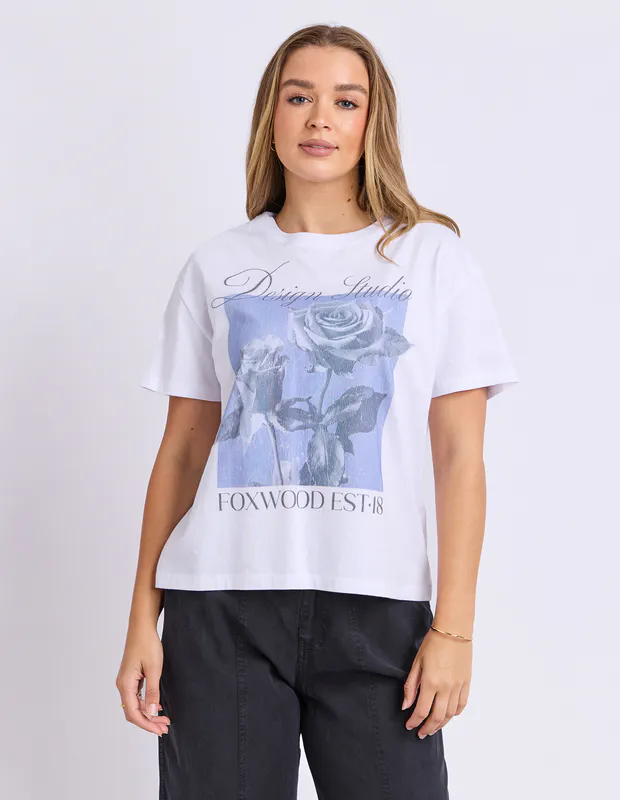 Model wearing Cornflower Blue Studio Rose Tee By Foxwood Available at Beetees Nelson