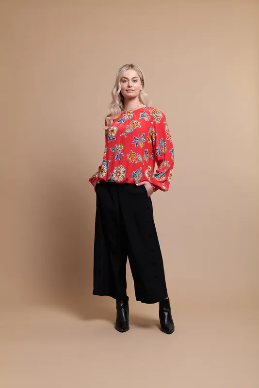 Model wearing Fire Floral Coloured  Top - Rouche Sleeve By Foil Available at Beetees Nelson