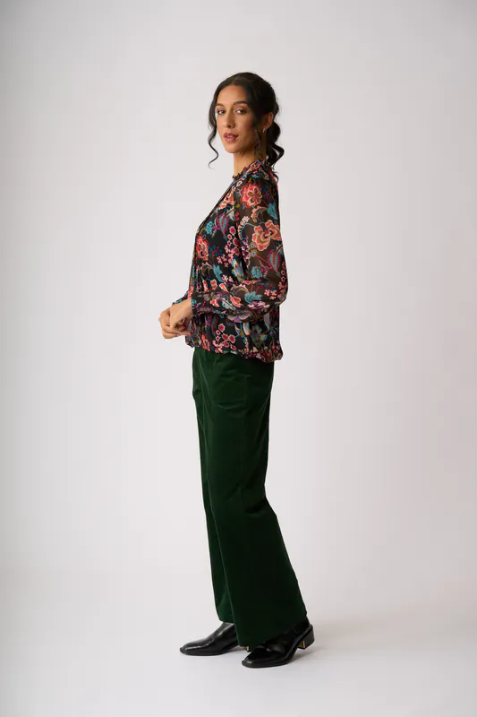Model wearing Floral Burst Pintuck Front, Shirred Cuff Blouse By Memo Available at Beetees Nelson